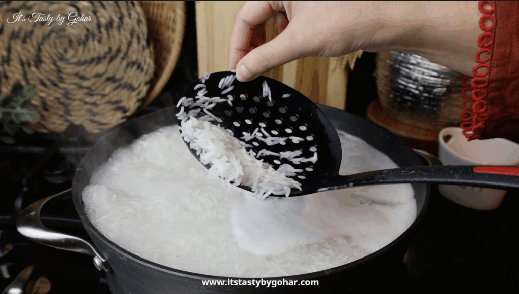 Fluffy biryani rice with whole spices and vinegar