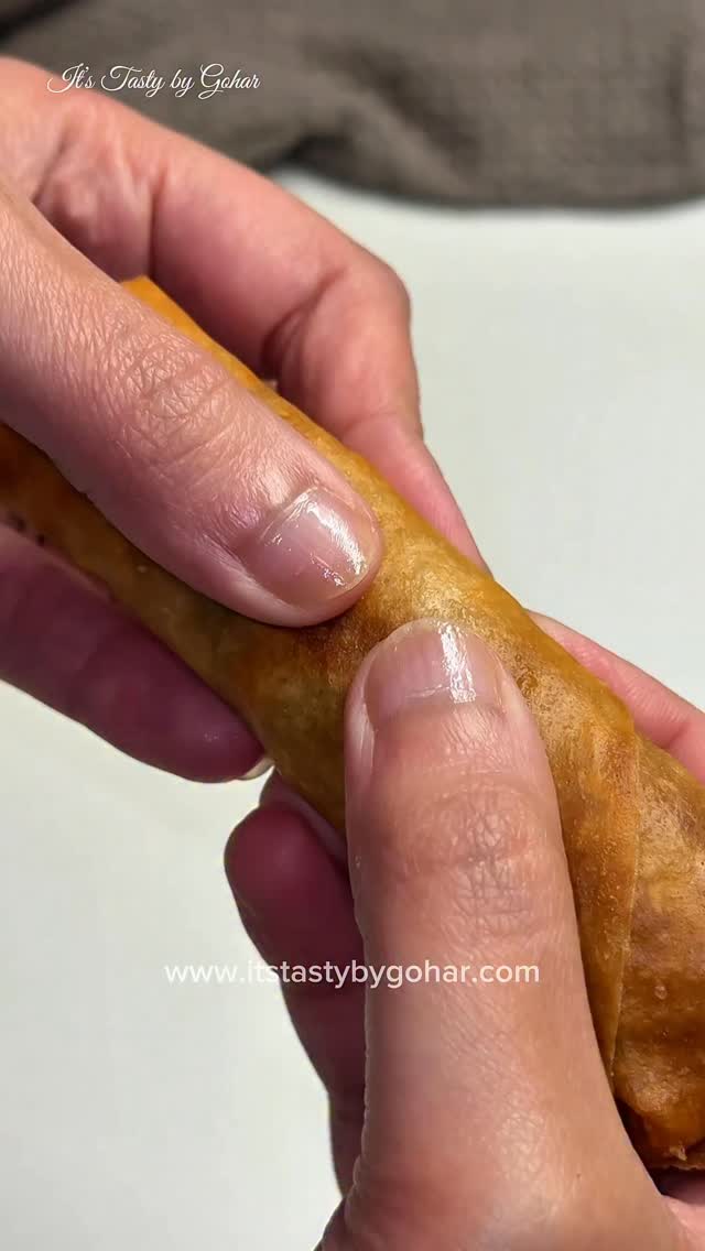 ✨Crispy Crunchy Chinese Chicken Spring Rolls✨

These crispy, golden Chinese spring rolls are packed with flavorful shredded chicken and crunchy vegetables. 

Ingredients
- 2 cups boiled & shredded chicken
- 2 tbsp oil
- 3–4 garlic cloves, finely chopped
- 1 cup shredded cabbage
- ½ cup julienned carrots
- ½ cup thinly sliced bell peppers (any color)
- ½ cup bean sprouts
- 2 green onions, chopped
Sauces & Seasoning:
- 1–2 tbsp soy sauce
- 1 tbsp hoisin sauce
- 1 tbsp oyster sauce
- Salt to taste
- ½ tsp black pepper
- ½ tsp white pepper
- Spring roll wrappers
- Oil for frying

Method
1️⃣ Prepare the Filling
1. Heat 2 tbsp oil in a pan on medium heat.
2. Add chopped garlic and sauté until fragrant (do not brown).
3. Add carrots and bell peppers first. Stir fry for 1–2 minutes.
4. Add cabbage and bean sprouts. Cook on high heat for 2–3 minutes — vegetables should stay slightly crunchy.
5. Add shredded chicken and mix well.
6. Add soy sauce, hoisin sauce, oyster sauce, salt, black pepper, and white pepper.
7. Cook for another 1–2 minutes.
8. Turn off heat and mix in green onions.
9. Let filling cool completely before rolling.

2️⃣ Rolling the Spring Rolls
1. Place wrapper in a diamond shape.
2. Add 2–3 tbsp filling near the bottom corner.
3. Fold bottom over filling, fold sides inward, and roll tightly.
4. Seal the edge with a little flour-water paste.

3️⃣ Frying
- Heat oil on medium.
- Fry until golden brown and crispy.
- Do not overcrowd the pan.
- Fry on medium heat for extra crunch.
Drain on paper towel.

Air Fryer Option
- Brush lightly with oil.
- Air fry at 375°F for 10–12 minutes, flipping halfway.

Freezing Tips
- Arrange uncooked spring rolls in a single layer.
- Freeze until firm, then transfer to ziplock bag.
- Fry directly from frozen — no need to thaw.